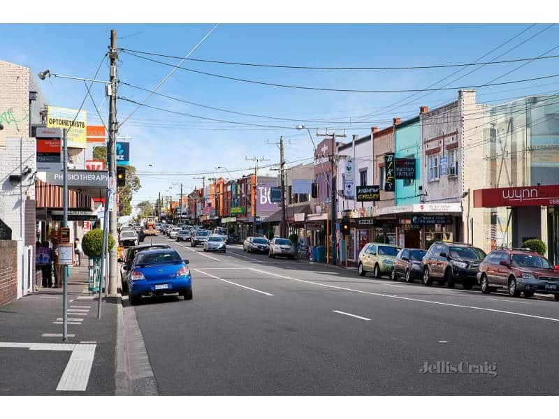 Shopfronts and parked cars along a shopping strip in Ashburton, Melbourne