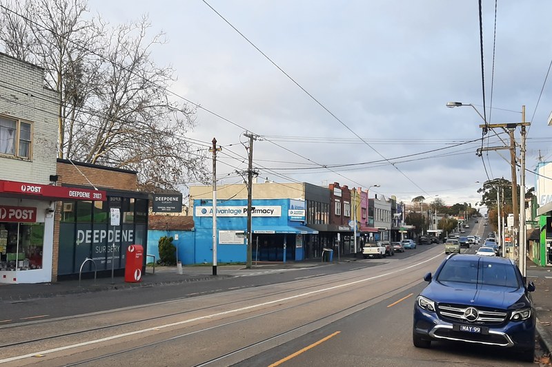 A small local shopping strip with parked cars in Deepdene, Melbourne