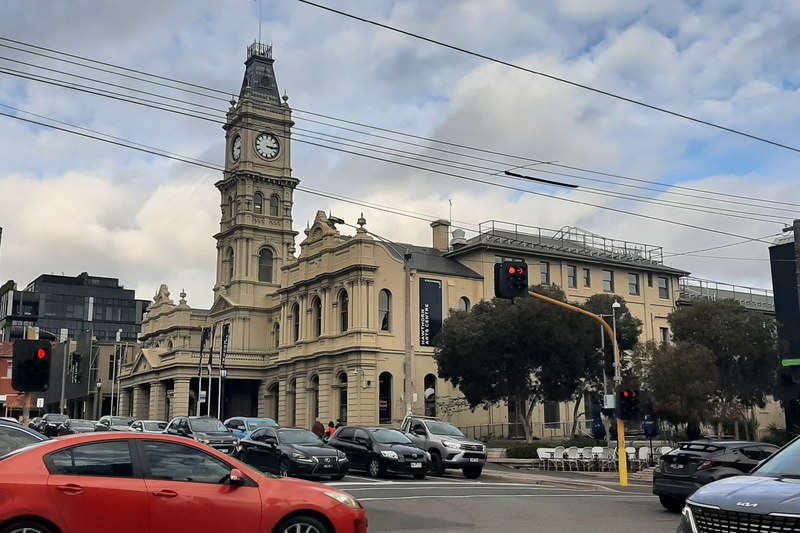 Cars and shopfronts along a busy shopping street in Hawthorn, Melbourne