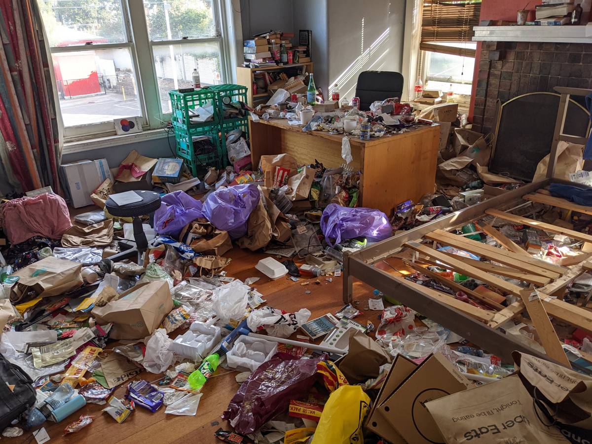 Room filled with accumulated rubbish during a full house clearout