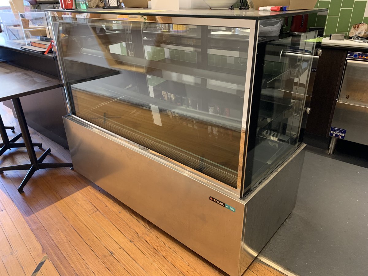 Glass deli display cabinet removed from a cafe for collection