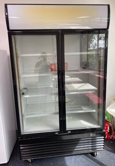 Commercial glass-door display fridge cleared from a shop