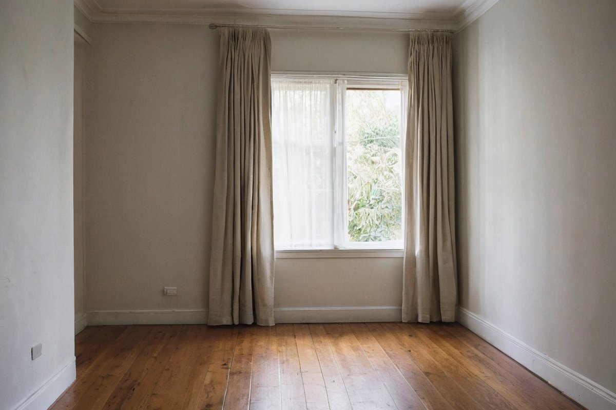 A calm, empty bedroom in a Melbourne home after a respectful deceased estate clear-out